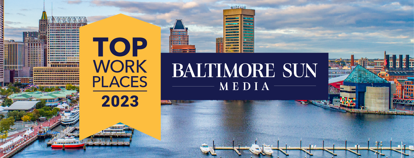 Maryland Top Workplaces 2023 emblem over skyline picture of the baltimore inner harbor.